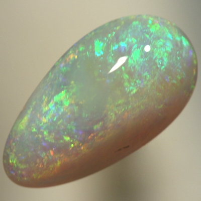 SOLID SEMI BLACK OPAL 3 D play of colour with sparkles of orange and green